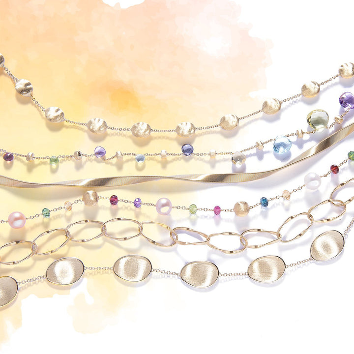 marco bicego gold and gemstone bracelets on watercolour background